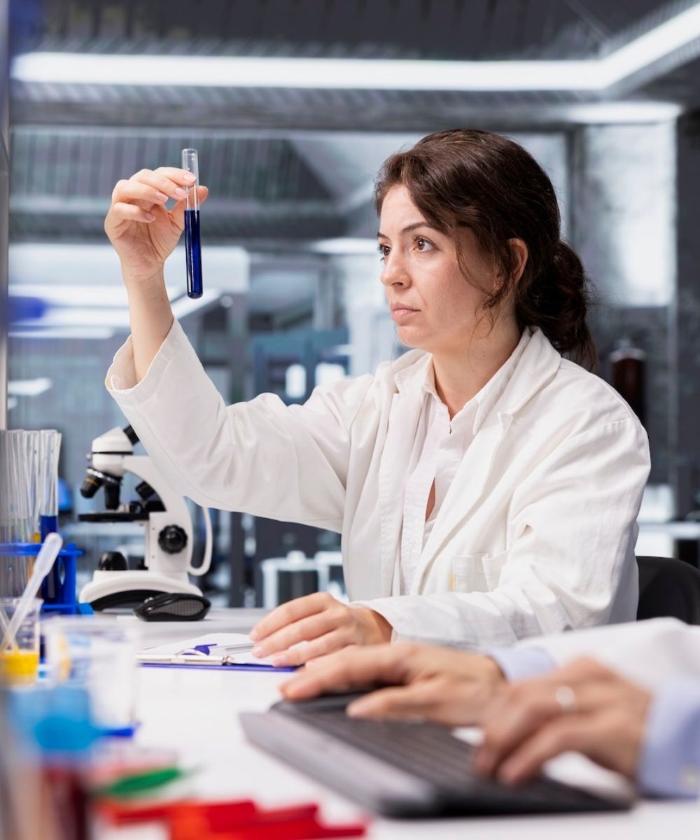 Analytical Chemist Investigates Chemical Sample Properties Using Test Tube