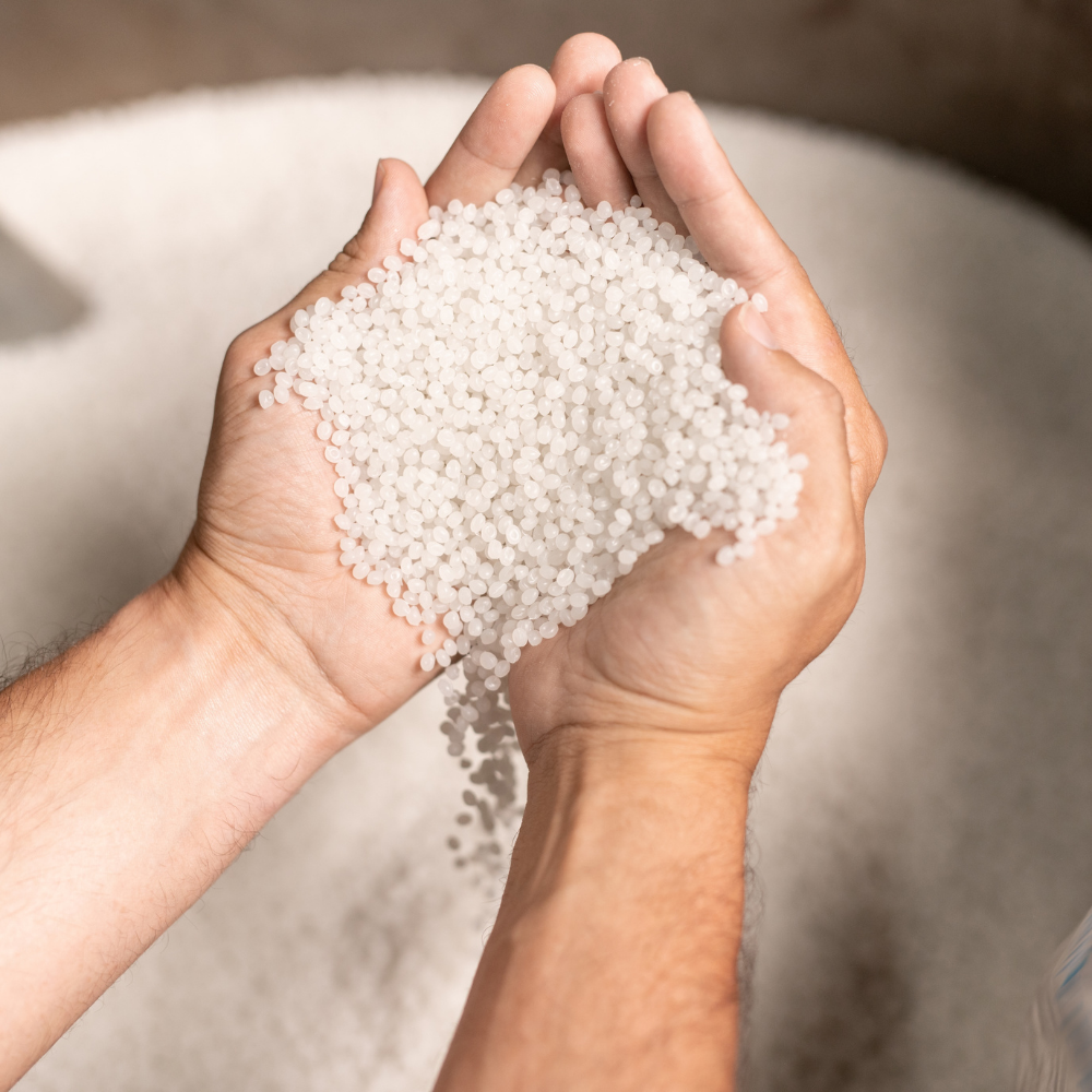 View of hands holding tiny plastic balls